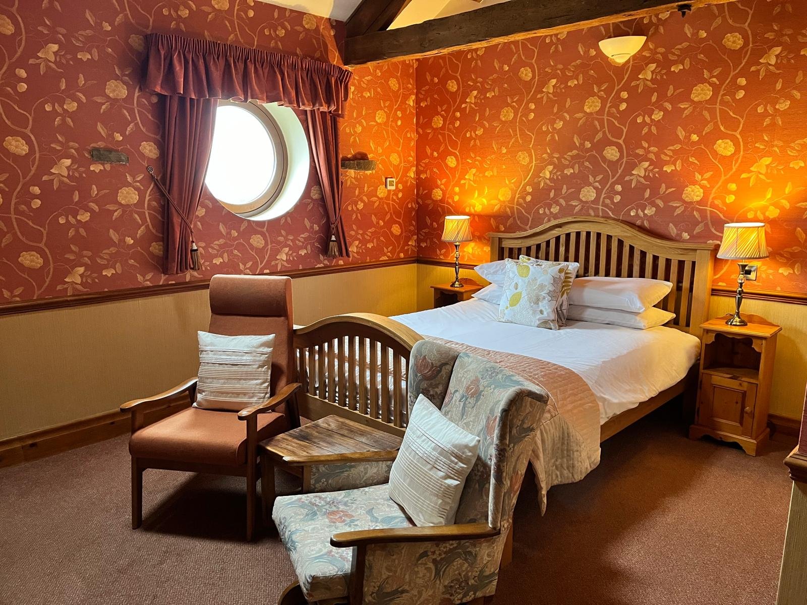 king terracotta room at the Dog and Partridge Inn